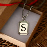 Custom initial cut on the sterling silver dog tag
