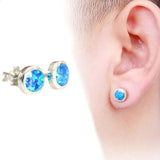 rounded blue opal studs on mens ear